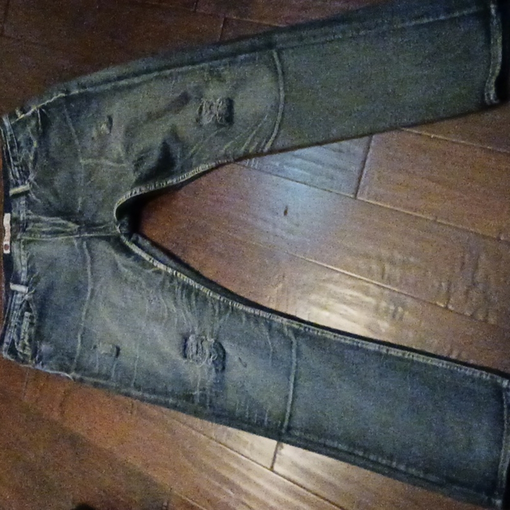 Kaalu Jean's faded with the ragged legs